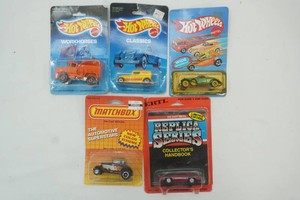 group of NIP Ertl, Matchbox, and Hot Wheels die cast toys