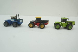 Ford, Versatile, and Steiger 4 wheel drive die cast metal 164 scale tractors