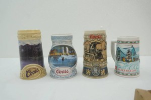 3 Coors and 1 Budweiser beer steins