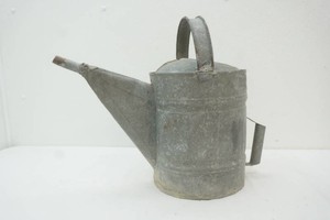 vintage galvanized metal watering can with arched handle