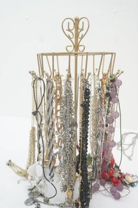 jewelry stand loaded with many Fancey necklaces