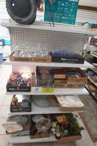 large lot of glassware, sheets, fertilizer spreader, books, and decor