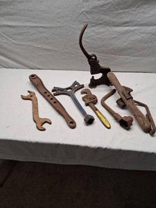 Antique Hand Tools Including Pipe Wrench, Riveter, and More