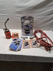 Assortment of Garage Tools and Accessories including Jumper Cables, Clip Lights, Old Torch, and Clamps