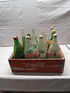 Vintage Coca-Cola and Soda Bottle Collection Including Coca-Cola, Squirt, Canada Dry, Diet Pepsi, A&W, and 7up