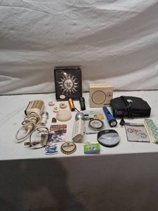 Lot of miscellaneous household items including a solid-state radio, a Conair electric massager, flashlights, outlet strips, magnetic tape, solar stair light, and more