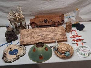 Wooden Decorative Wagon with Home Decor Items including Lamp Shade, Straw Hat, Wooden Geese, and Plaques