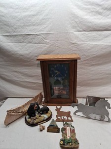 Collection of Home Decor and Figurines including Wooden Clock, Metal Horse Silhouette, and Bear Family Sculpture