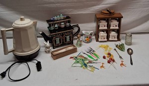 Vintage Kitchenware Collection including spice rack, Enesco figurine, floral pitcher, ceramic rabbit, and a vintage electric percolator