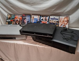Lot of Electronics Including Aiwa DVD Player, Sony DVDVHS Combo, Sanyo VHS Player, and Various DVDs