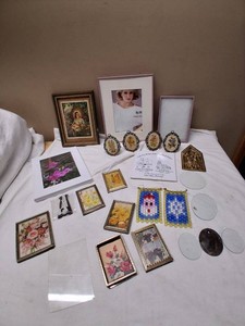 Various Picture Frames and Decorative Items including Vintage Style, Floral Designs, Religious Theme, and Beadwork