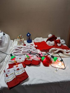 Christmas-themed holiday items including Santa hats, stockings, decorative lights, and figurines.