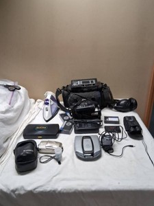 Lot including Quasar Palm Sight Camcorder VM-1469, Tiger Quiz Wiz, Memorex Portable CD Player, Olympus Camera, and accessories