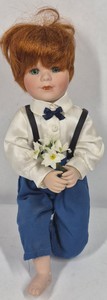 Red-Haired Porcelain Boy Doll with Blue Pants, Suspenders & Flower Bouquet