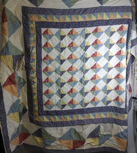 Vintage Handmade Multicolor Patchwork Triangle Quilt with Geometric Design and Floral Fabric