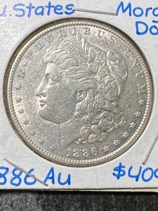 1886 US MORGAN SILVER DOLLAR AU