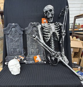 Large lot of Halloween decorations, including skeleton, light up headstones, and more
