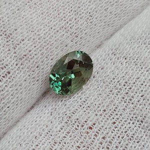 0.76 Carat Greenish-Blue Faceted Oval Gemstone
