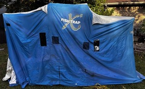 Fish Trap X4 Enclosed Ice Fishing Shelter With FourSeats with Poles and other supplies.