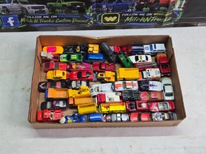 Matchbox and Lesney Diecast and Toy Vehicles Lot including Dump Trucks, Police Cars, and Sports Cars Dating Back to the 1970s