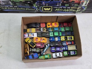Hot Wheels Diecast Car Collection including 67 Camaro, Batmobile, Chevy Silverado, and Audi RS5 - 1980s, 1990s and Newer