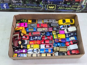 Lot of assorted die-cast vehicles including Hot Wheels, Maisto, Matchbox, Racing Champions, Majorette, and others