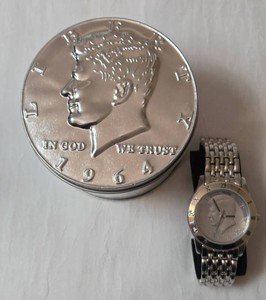 New "August Steiner Kennedy Coin Face Watch". Features a genuine 1983 US Kennedy half dollar face coin dial-VERY COLLECTIBLE,&nbsp; Watch is in EXCELLENT WORKING CONDITION!