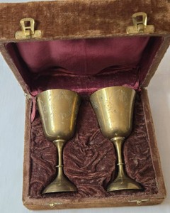 Two Vintage Silver Plated Metal Chalace with Hand Chiseled Floral Dcor 6 inches high and 3 inches in diameter.  Chalices come in velvet storage box.