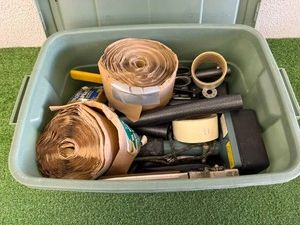 Tote of Carpet Installation Tools