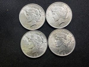 Four High Quality 1922 Silver Peace Dollars