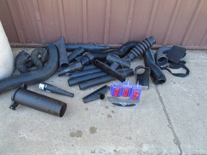 Plastic barrel of extension hoses & nozzles. As shown.
