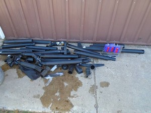 Galvanized garbage can full of nozzles & pipes. As shown.