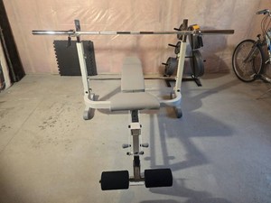 Adjustable Weight Bench with Barbell and Leg Attachment