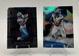 Amon-Ra St. Brown Football Card Lot including 2021 Panini Select Rookie Card