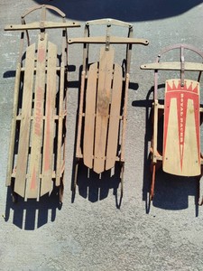 Three Vintage Sleds