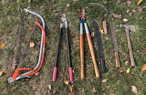 Assortment of Saws, Machetes, Trimmers and more