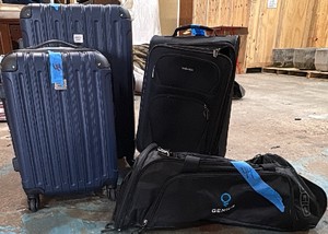 3 suitcases and 1 duffle bag