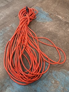 Extension cords, green hose, and a drive metal shoe horn