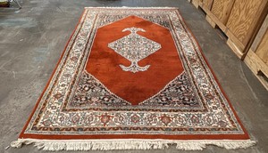 5 x 7 red rug with traditional, hand-knotted ends