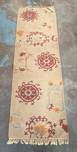 Two floor runner style rugs