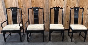4 black chairs with cushions