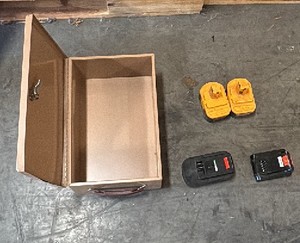 Brown case and 4 drill batteries