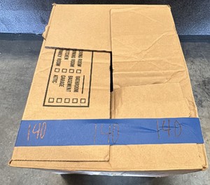 Box of fragile kitchen items and cake dishes