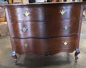 Wooden dresser with older wheels
