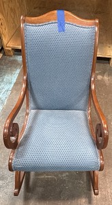 Wooden rocking chair with blue cushion