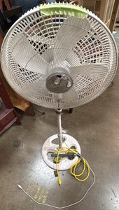 Stationary fan and yellow power strip