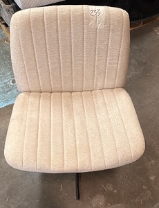 Tan swivel chair
