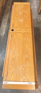 Light-colored headboard with wood storage chest attachment