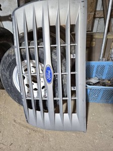 Ford Front Grille with Blue Oval Emblem and Wheel Tire
