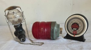 Vintage "RELO" Ribbed Beacon Light with a metal and brass base. Resembles a marine navigation light or aviation runway signal light. Magnetic Polycast Protractor. Coleman compact Propane Lantern.